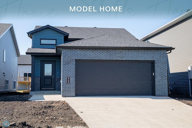 contemporary home with brick siding, a garage, and roof with shingles