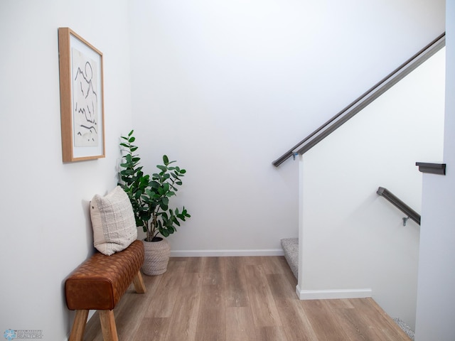 stairs featuring baseboards and wood finished floors