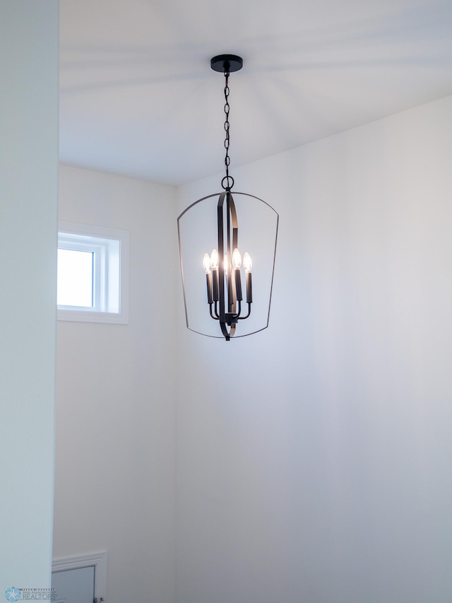 details with an inviting chandelier