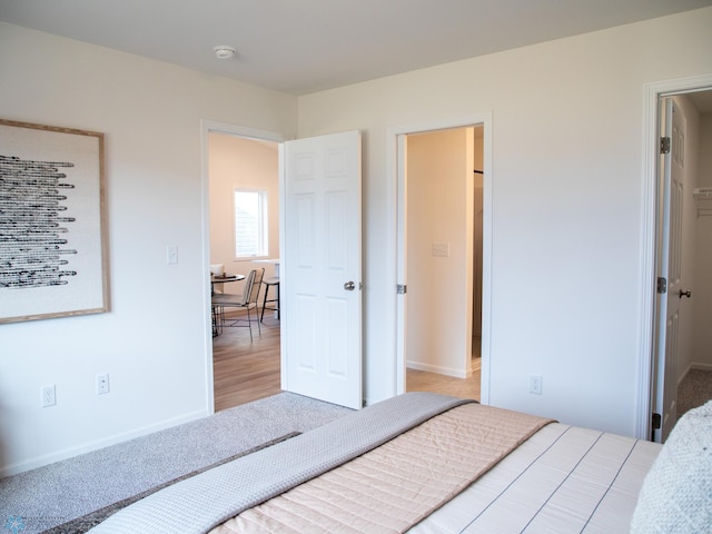 bedroom featuring baseboards