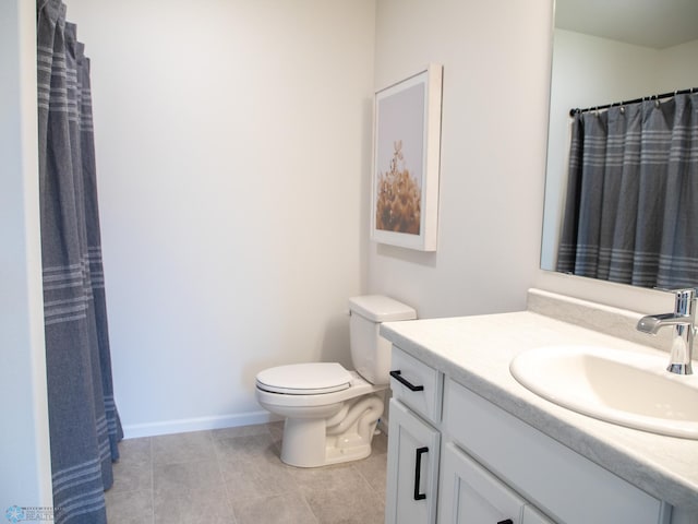 full bath featuring vanity, tile patterned flooring, baseboards, and toilet