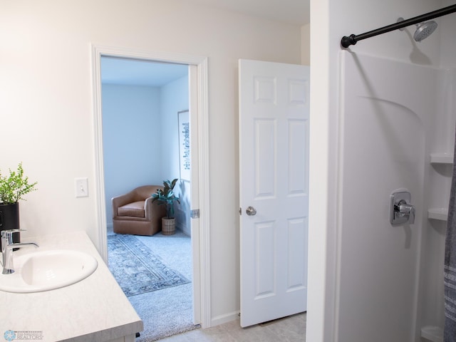 bathroom featuring vanity and a shower