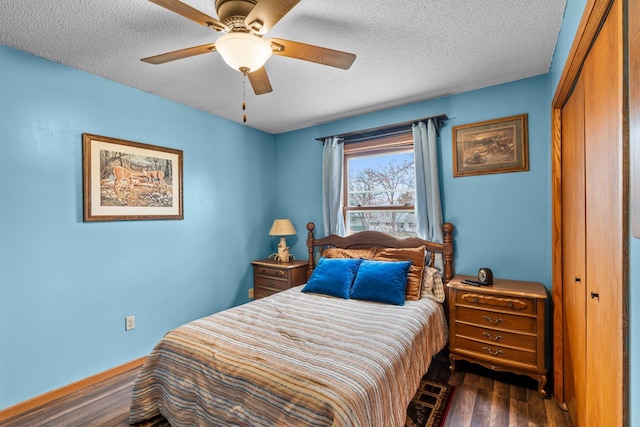 13229 Fremont Ave, Zimmerman, MN 55398 - bedroom with dark wood finished floors, a closet, a textured ceiling, and a ceiling fan