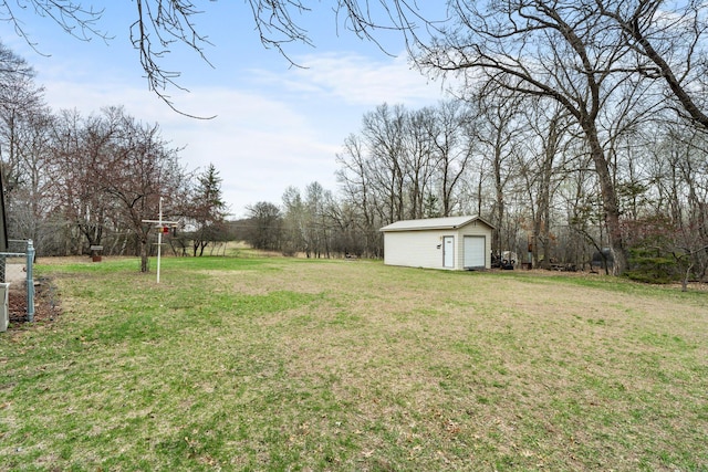 13229 Fremont Ave, Zimmerman, MN 55398 - view of grassy yard featuring an outbuilding and a detached garage