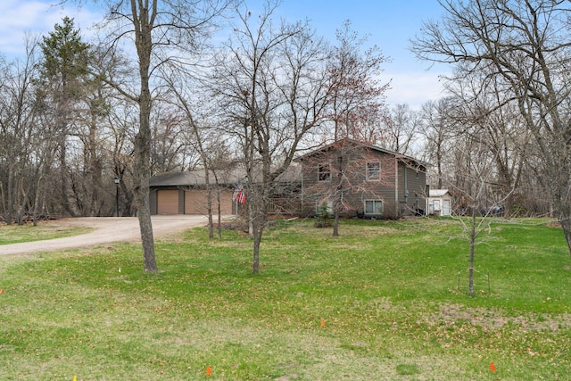 13229 Fremont Ave, Zimmerman, MN 55398 - view of front of property featuring a garage, a front lawn, and driveway