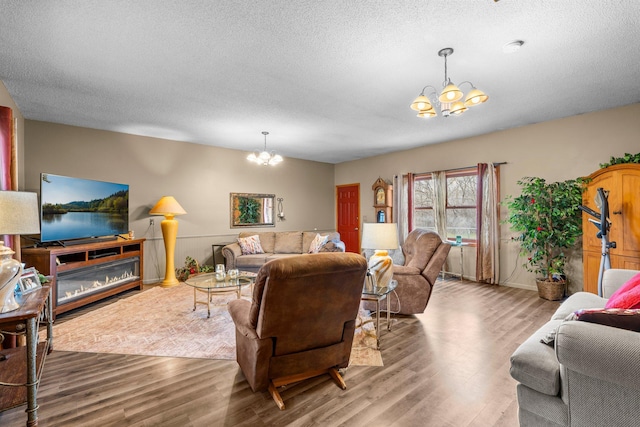 13229 Fremont Ave, Zimmerman, MN 55398 - living area with a chandelier, wood finished floors, and a textured ceiling