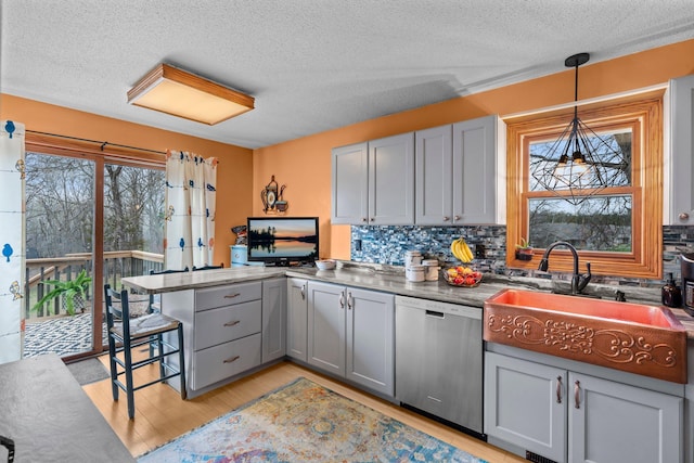 13229 Fremont Ave, Zimmerman, MN 55398 - kitchen featuring dishwasher, gray cabinetry, a peninsula, backsplash, and a textured ceiling