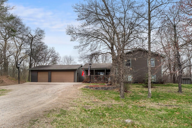 13229 Fremont Ave, Zimmerman, MN 55398 - split level home with covered porch, dirt driveway, an attached garage, and a front yard