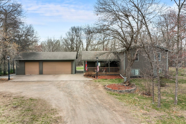 13229 Fremont Ave, Zimmerman, MN 55398 - view of front of property featuring covered porch, dirt driveway, and an outbuilding