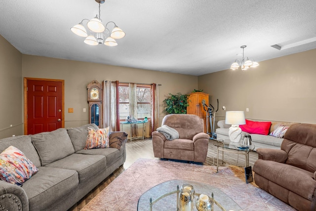 13229 Fremont Ave, Zimmerman, MN 55398 - living room featuring a chandelier, wood finished floors, and a textured ceiling