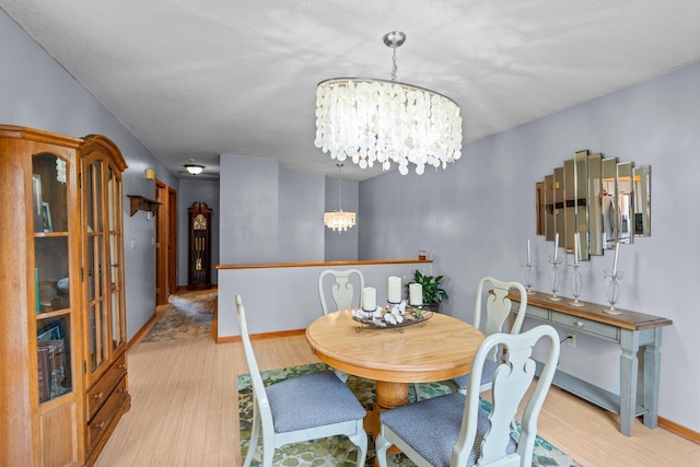 13229 Fremont Ave, Zimmerman, MN 55398 - dining room featuring a chandelier and wood finished floors