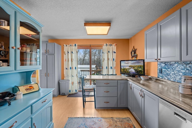 13229 Fremont Ave, Zimmerman, MN 55398 - kitchen with dishwasher, gray cabinets, a peninsula, light wood-type flooring, and tasteful backsplash
