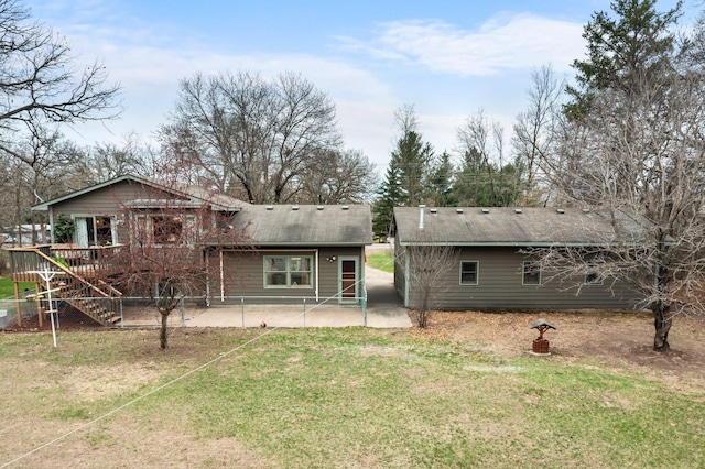 13229 Fremont Ave, Zimmerman, MN 55398 - rear view of property featuring a patio, a wooden deck, stairway, and a yard
