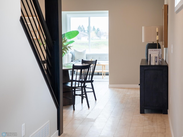 dining space featuring baseboards and visible vents