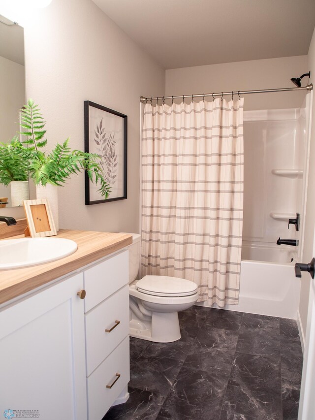 bathroom with vanity, shower / bathtub combination with curtain, toilet, and marble finish floor