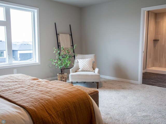 carpeted bedroom with baseboards
