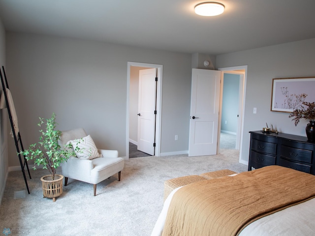 carpeted bedroom featuring baseboards