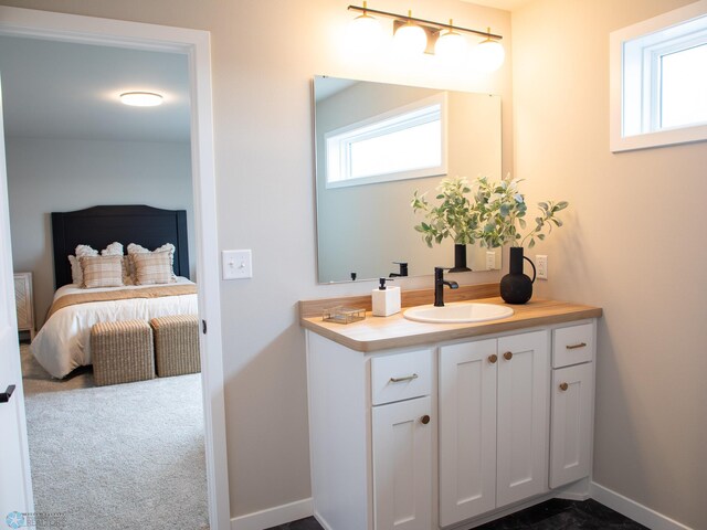 bathroom featuring vanity and baseboards