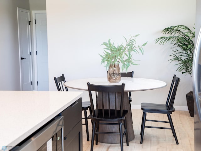 1479 66th Ave S, Fargo, ND 58104 - dining area with beverage cooler and baseboards