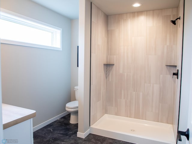 1479 66th Ave S, Fargo, ND 58104 - full bath featuring tiled shower, toilet, baseboards, and recessed lighting
