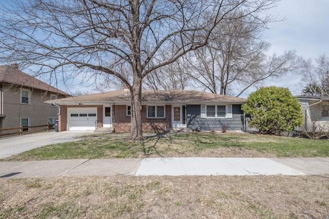 ranch-style house featuring a garage, brick siding, a front yard, and concrete driveway