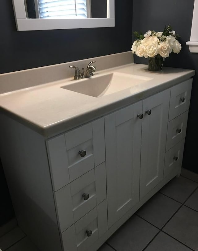 bathroom featuring tile patterned floors and vanity