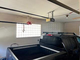 garage featuring a garage door opener