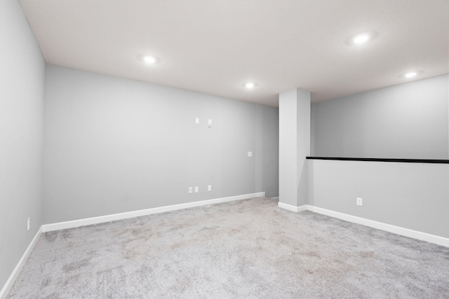 finished basement with carpet floors, baseboards, and recessed lighting