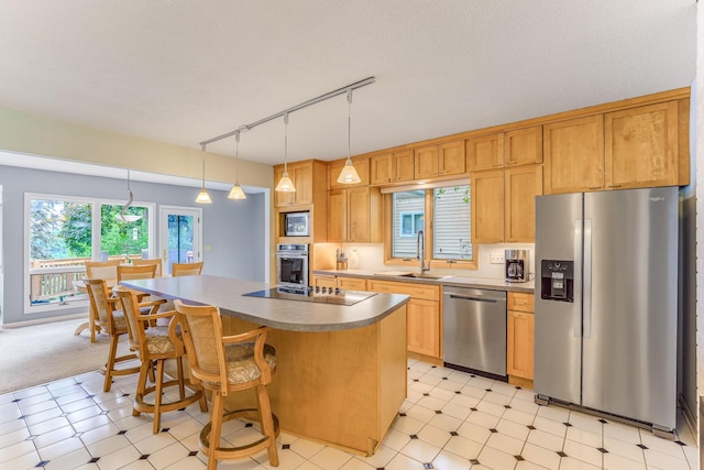 3310 Lake Johanna Blvd, Arden Hills, MN 55112 - kitchen with stainless steel appliances, a sink, light flooring, and track lighting