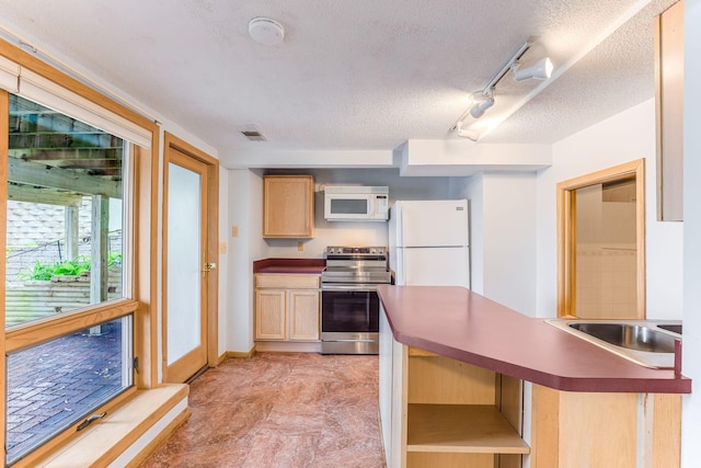 3310 Lake Johanna Blvd, Arden Hills, MN 55112 - kitchen featuring white appliances, light brown cabinetry, a sink, a textured ceiling, and dark countertops