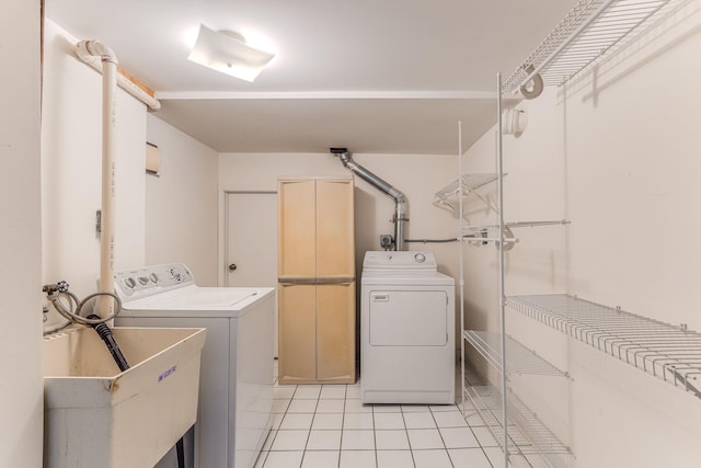 3310 Lake Johanna Blvd, Arden Hills, MN 55112 - washroom with washing machine and dryer and light tile patterned flooring