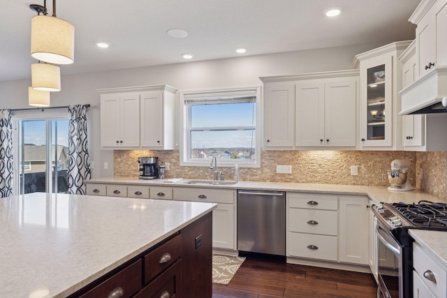 565 Juniper Ct N, Lake Elmo, MN 55042 - kitchen featuring white cabinets, stainless steel appliances, dark wood-type flooring, and a sink
