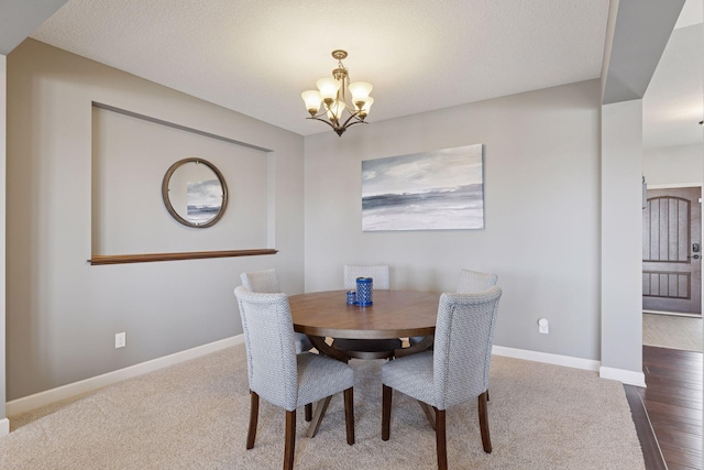 565 Juniper Ct N, Lake Elmo, MN 55042 - dining area with baseboards, a notable chandelier, and carpet