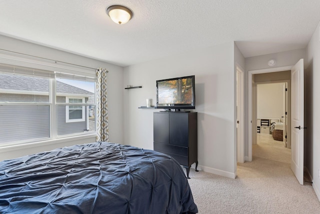 565 Juniper Ct N, Lake Elmo, MN 55042 - bedroom with light colored carpet, baseboards, and a textured ceiling