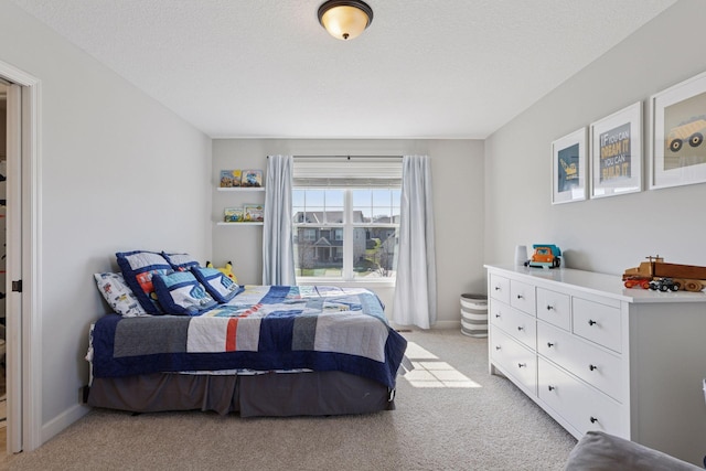 565 Juniper Ct N, Lake Elmo, MN 55042 - bedroom featuring light carpet and a textured ceiling