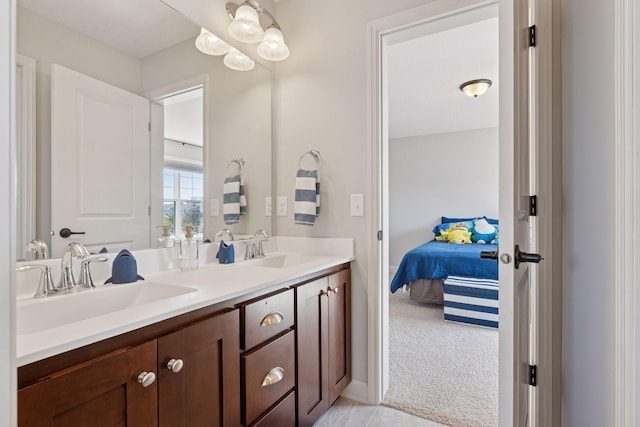 565 Juniper Ct N, Lake Elmo, MN 55042 - ensuite bathroom with double vanity, connected bathroom, and a sink