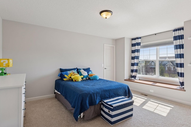 565 Juniper Ct N, Lake Elmo, MN 55042 - carpeted bedroom with visible vents, baseboards, and a textured ceiling