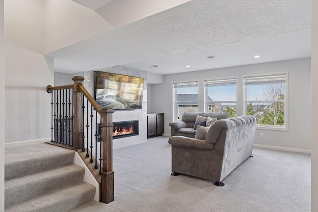 565 Juniper Ct N, Lake Elmo, MN 55042 - living area featuring recessed lighting, carpet, a tile fireplace, baseboards, and a textured ceiling