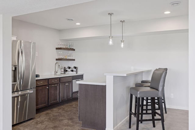 565 Juniper Ct N, Lake Elmo, MN 55042 - bar with recessed lighting, wet bar, a sink, stainless steel fridge, and hanging light fixtures