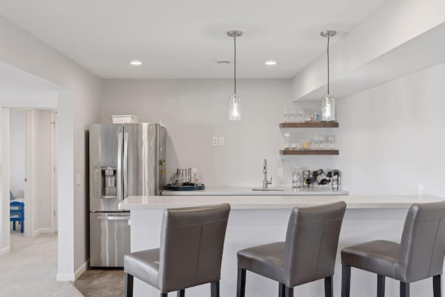 565 Juniper Ct N, Lake Elmo, MN 55042 - bar featuring a sink, light colored carpet, wet bar, decorative light fixtures, and stainless steel refrigerator with ice dispenser