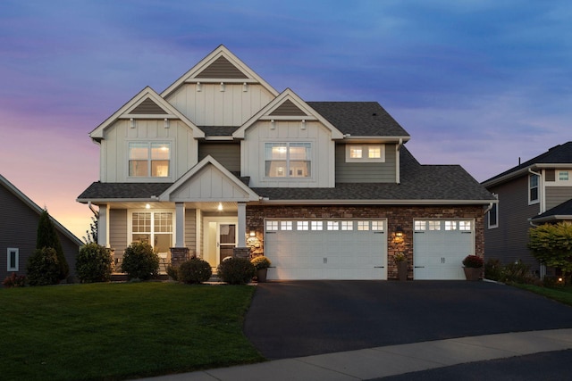 565 Juniper Ct N, Lake Elmo, MN 55042 - craftsman inspired home featuring board and batten siding, asphalt driveway, a front lawn, and an attached garage