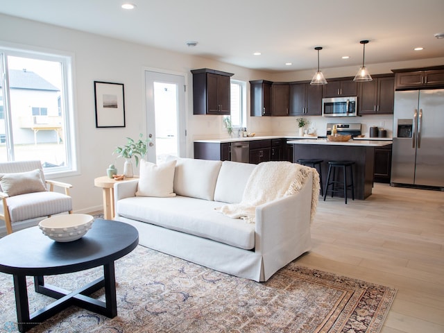 6735 Meadow View Dr S, Fargo, ND 58104 - living room featuring recessed lighting, baseboards, and light wood-style flooring