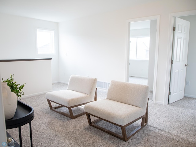6735 Meadow View Dr S, Fargo, ND 58104 - sitting room featuring plenty of natural light, carpet flooring, and baseboards