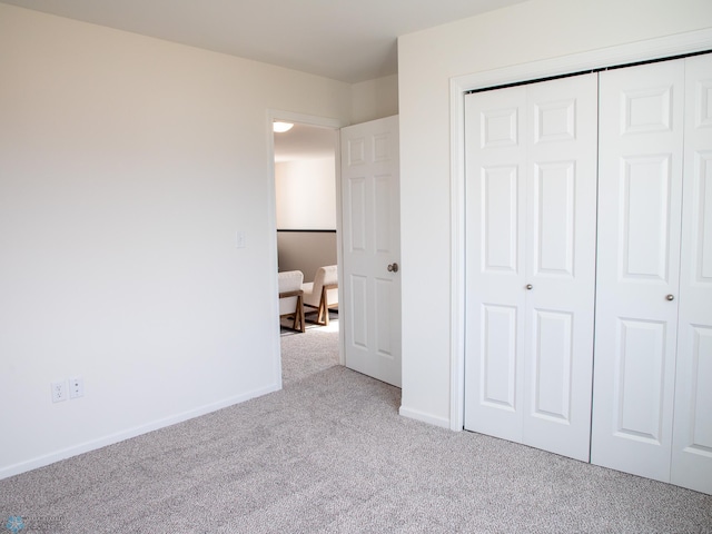 6735 Meadow View Dr S, Fargo, ND 58104 - unfurnished bedroom featuring carpet flooring, baseboards, and a closet