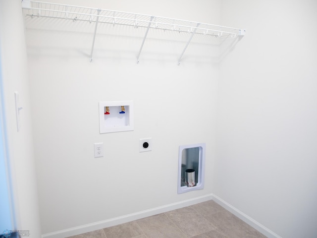 6735 Meadow View Dr S, Fargo, ND 58104 - clothes washing area featuring hookup for an electric dryer, laundry area, light tile patterned floors, baseboards, and hookup for a washing machine