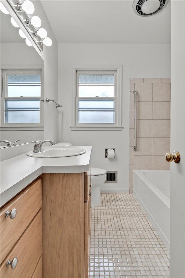 full bath featuring toilet, baseboards, visible vents, tile patterned floors, and vanity