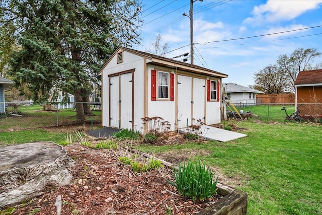 view of shed with a fenced backyard