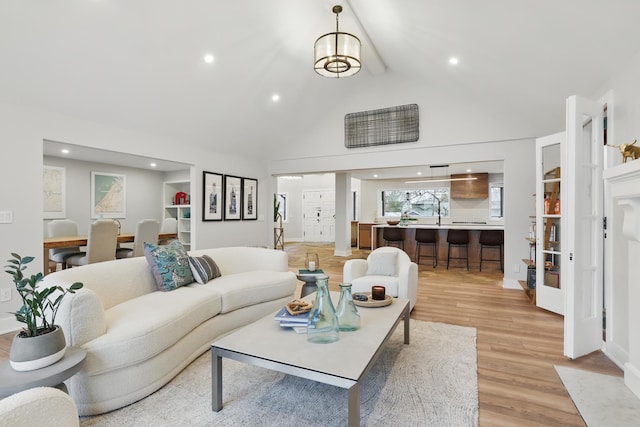 211 Peninsula Rd, Medicine Lake, MN 55441 - living room with light wood-type flooring, recessed lighting, high vaulted ceiling, and beam ceiling