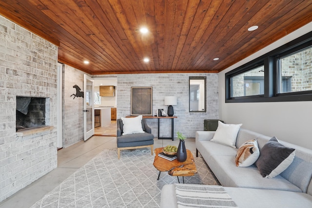 211 Peninsula Rd, Medicine Lake, MN 55441 - living area with wooden ceiling, finished concrete floors, brick wall, recessed lighting, and an outdoor brick fireplace