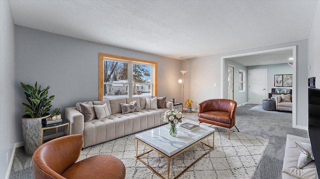 living room featuring carpet floors and baseboards